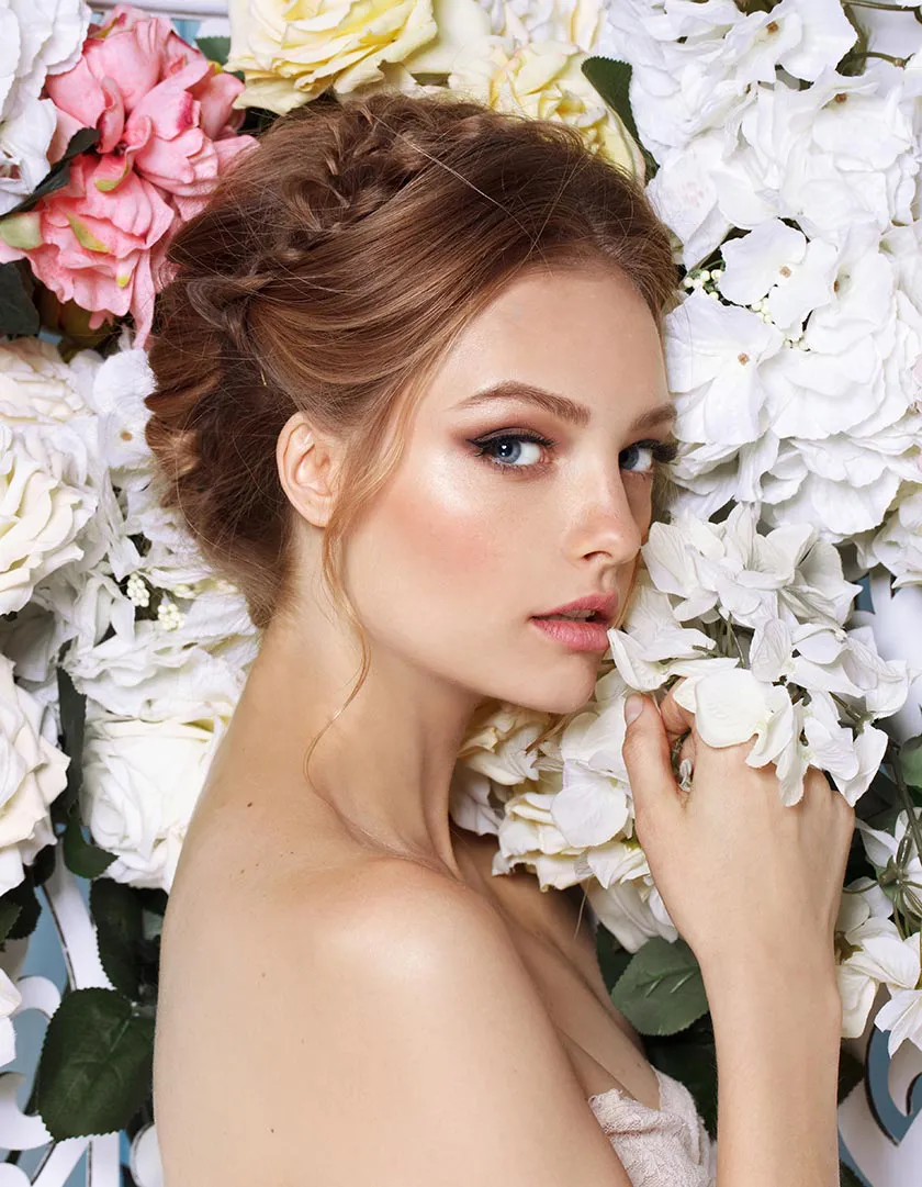 A woman lying in a blooming flower field